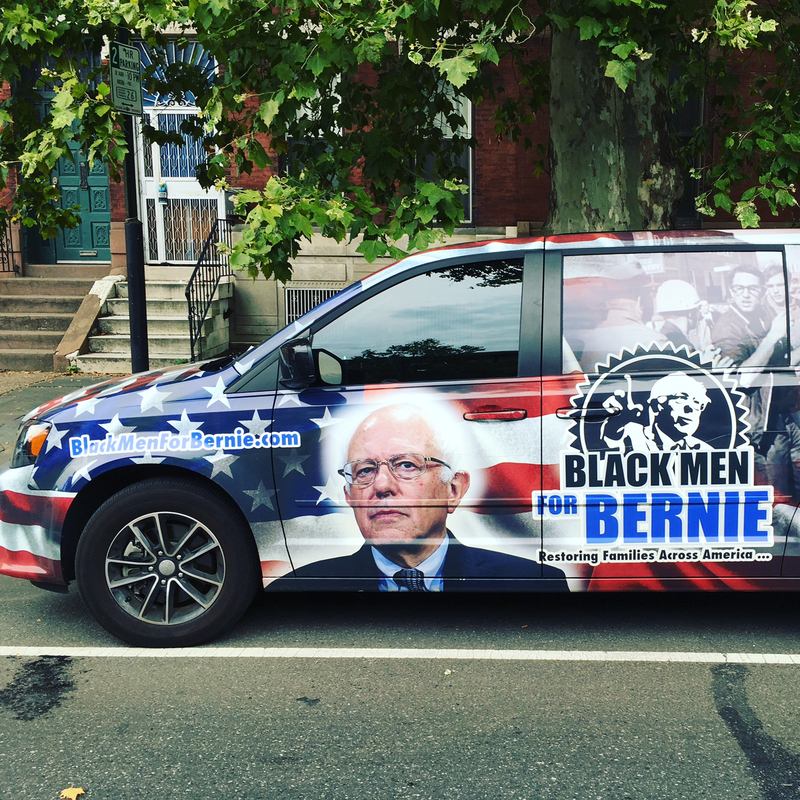 A 'Blacks for Bernie' car makes its appearance at protests outside of the Democratic National Convention in Philadelphia.